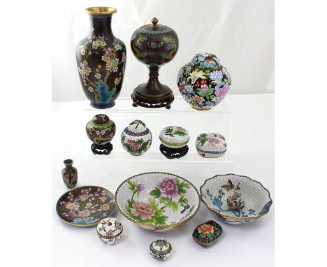 A quantity of predominantly black ground and white ground Chinese cloisonné ware to include a balloon-shaped jar and cover, b
