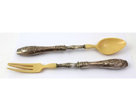 A cased set of salad servers with white metal scroll and wheatsheaf decorated handles to ivory fork and spoon servers, length