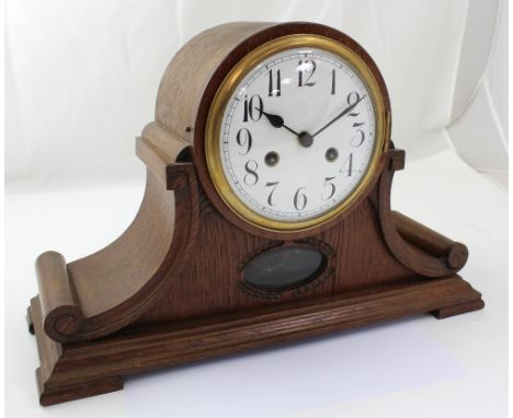 Junghans; a 20th century oak-cased eight-day Napoleon hat mantel clock, the white enamel dial set with Arabic numerals, heigh