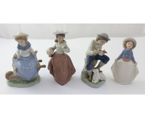 Four Lladró/Nao figures, a young shepherd and lamb, a young lady with bird in hand seated on a wheel barrow and two others, a