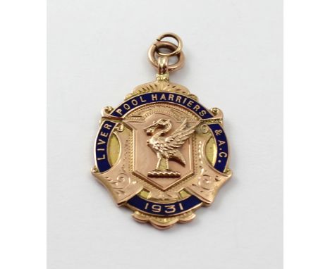 A 9ct rose gold and enamel 'Liverpool Harriers & A.C.' pendant inscribed to the reverse '880 Yards Championship First J.S. Tu