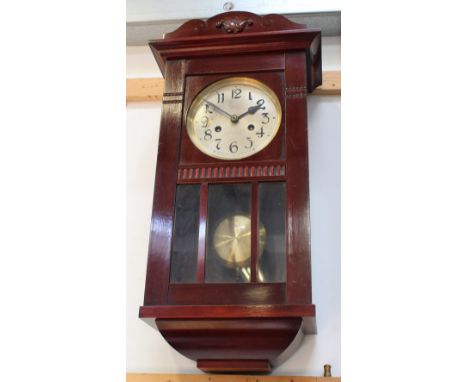 A 20th century eight-day wall clock, the dial set with Roman numerals, length 63cm. CONDITION REPORT Please note that this lo
