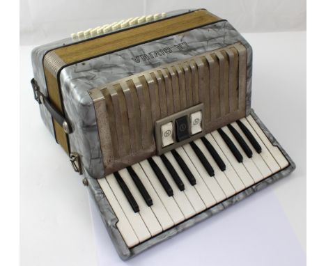 A twenty-six key La Davina piano accordion in original carrying case.