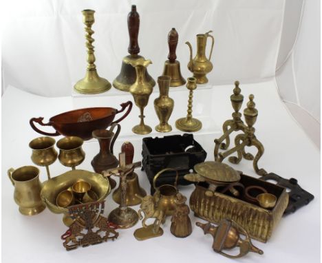 A mixed lot of metalware to include brass shell casings, a plated teapot, flatware, hip flasks etc.