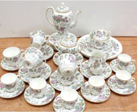 A mid-to-late 20th century Wedgwood bone china part coffee and tea service, decorated with pastoral scrolling autumn leaf pat