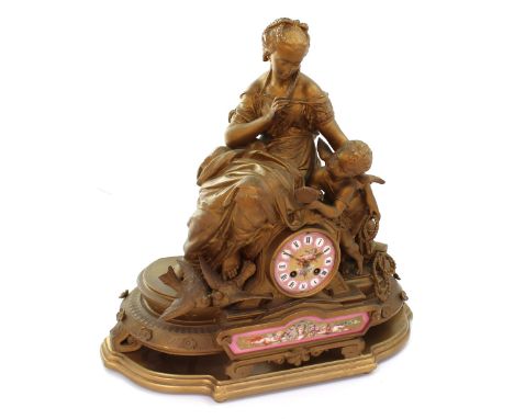 A large 19th century French mantel clock with figures of Venus and Cupid amidst casks of jewellery and doves surmounting the 