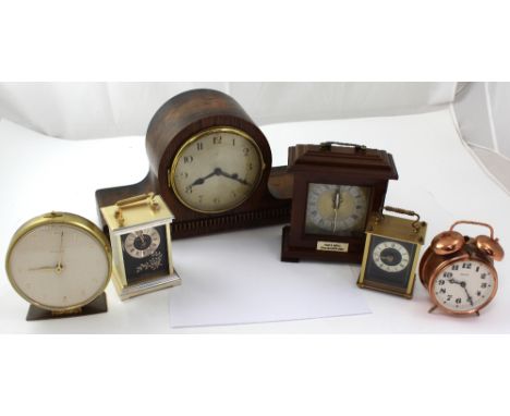 A c1950s eight-day oak-cased Napoleon hat clock, silvered dial set with Arabic numerals, height 23cm, a vintage Ingersoll cop