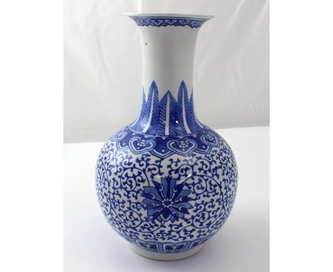 A large Chinese porcelain gourd vase with seal marks to the base, the body decorated with palm fronds and arabesques, height 