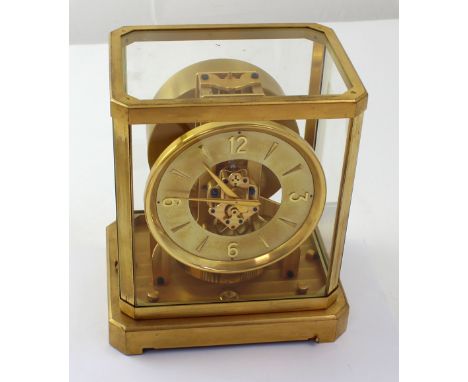 A Jaeger Le Coultre Atmos clock, c1955, the brass dial set with Arabic and baton numerals, with brass and glass dome, height 