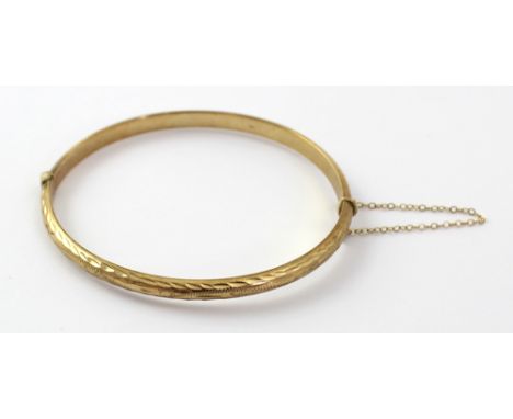 A 9ct gold hinged bangle, marked to inside, approx 6g.