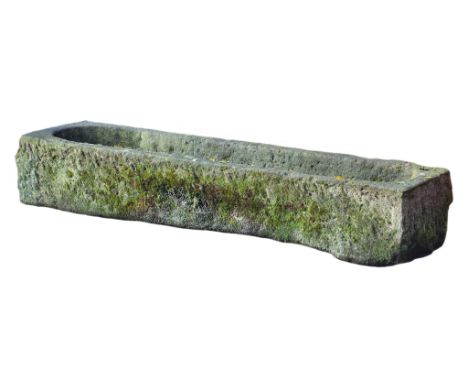 A Continental rough hewn limestone trough, 19th century, of rectangular form  A Continental rough hewn limestone trough,   19
