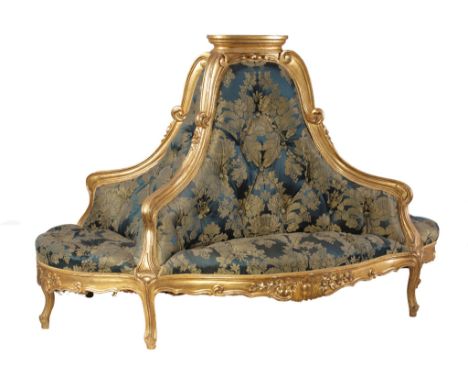 A Continental giltwood and composition and upholstered lobby sofa or  A Continental giltwood and composition and upholstered 