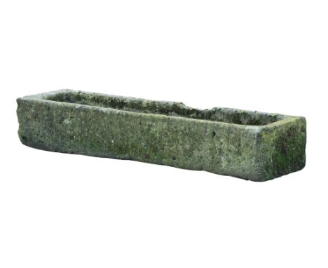 A Continental rough hewn limestone trough, 19th century, of rectangular form  A Continental rough hewn limestone trough,   19
