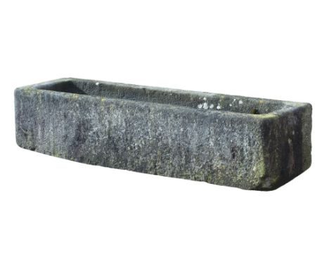 A Continental rough hewn limestone trough, 18th/ 19th century, 46cm high  A Continental rough hewn limestone trough,   18th/ 