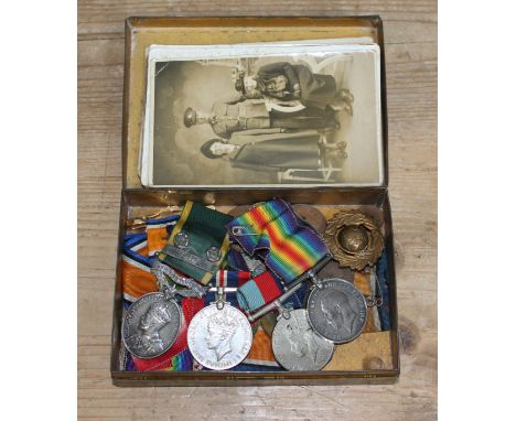 A tin of WWI and WWII medals comprising a George V Territorial Efficiency medal awarded to 3377105 W.O.CL2 W. HEYES. E LAN. R