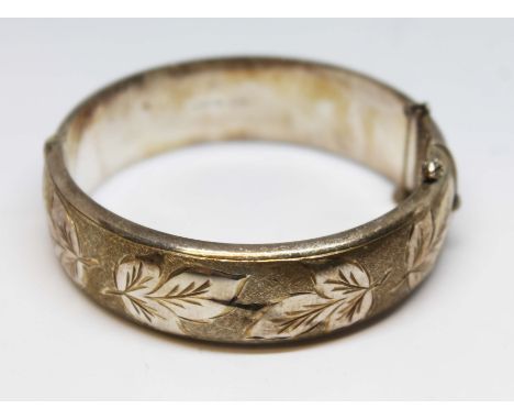 A hallmarked silver bangle, diameter 5.5cm, wt. 39.4g.Condition:- General wear through age and use, no sign of any major dama