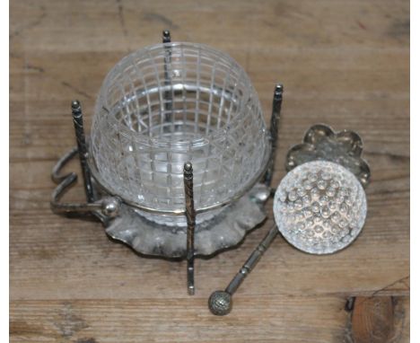 A novelty silver plated sugar bowl, the cut glass bowl modelled as a golf ball held in place with four gold clubs, crimped ba