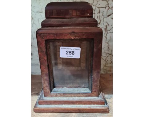 A wooden carriage clock case. 