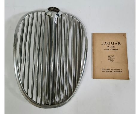 A Jaguar mkII grill together with a service manual. 