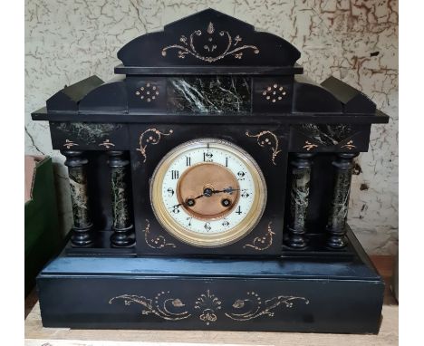 A black slate and marble architectural mantle clock. 