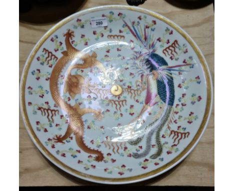 A Chinese porcelain charger, bearing Qianlong seal, 20th century, diameter 40cm.Condition:- General wear through age, some we