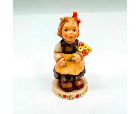 This special edition figurine depicts a young girl holding flowers. It has the Goebel backstamp on the bottom. Item comes wit