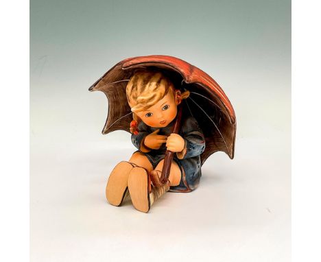 Hand painted in matte finish with pig tails wearing a blue rain jacket holding a red umbrella. Goebel Hummel backstamp. Issue
