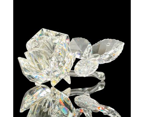 Sparkling faceted and molded crystal figurine modeled as a rose with leaf and stem. Swarovski acid marks. This item has its o