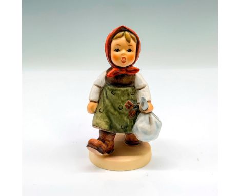 This figurine depicts a girl bringing a bundle of goodies and flowers for Grandma. It has the Goebel backstamp on the bottom.