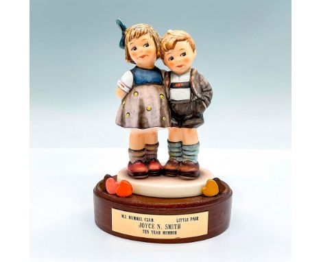 Hand painted exclusive edition ten year membership figure of a young boy and girl. Goebel backstamp. This item has its origin