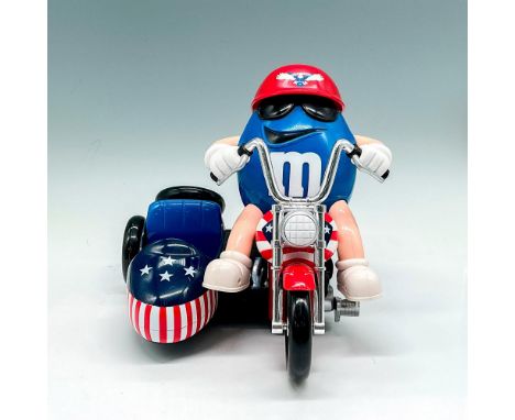 This Limited-Edition collectible is patriotic with his colors on his motorcycle as well as his attire. M emblem on his shirt 