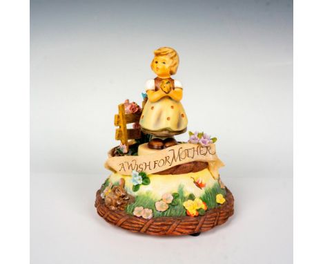Hand painted figure of a young girl holding flowers. Includes a musical base that plays I Just Called To Say I Love You. Goeb