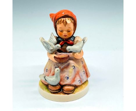Hand painted seated figural feeding birds. Colored in blue, orange and browns. Goebel backstamp. M.I. Hummel impressed mark. 