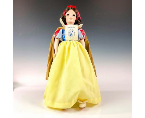 Handmade porcelain bisque doll with five-piece jointed bisque body, arms, and legs and human hair. Snow white in her yellow, 