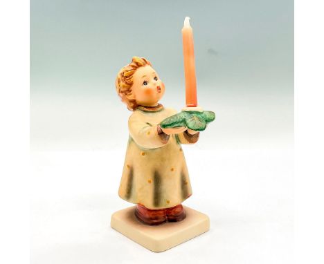 Hand painted figure of a young boy holding a candlestick decorated with leaves. Goebel backstamp. This item has its original 