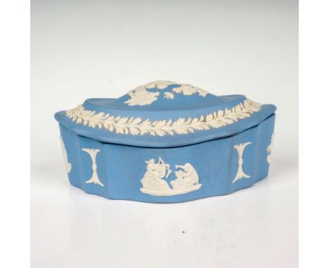 Light blue ground decorated in a relief depicting neoclassical scenes with a band of foliage surrounding the lid. Wedgwood Ma