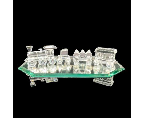 Sparkling crystal trainset. Part of the When We Were Young collection. Includes engine, passenger car, barrel car, and tender