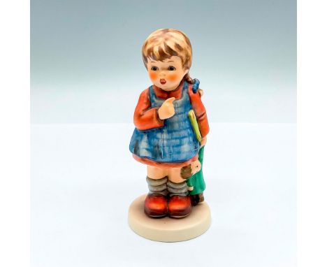 Hand painted exclusive edition figure of a young girl holding a book and a doll. Goebel backstamp. This item has its original