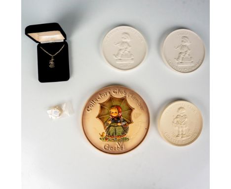 An assortment of gifts for Hummel Collector's Club members. Includes 4 plaques, 1 lapel pin, and 1 sterling silver necklace. 