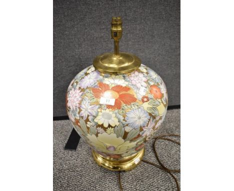 A large Chinese ceramic lamp base having brass base and fittings, with gilt ground and design of Chrysanthemums, Peonies, Hib