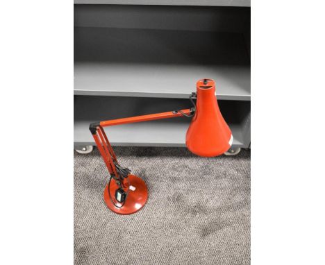 A vintage red 'Anglepoise' lamp.
in working order