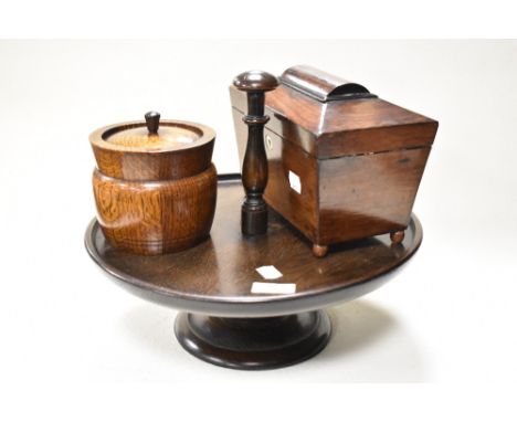 A late 19th century tea caddy with two internal lidded compartments, a footed oak serving tray with handle, and an oak tobacc