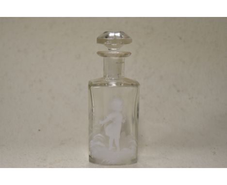A 20th century clear glass perfume bottle having faceted stopper and white enamel decoration in the Mary Gregory style.