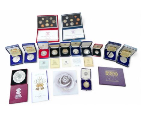 A collection of silver proof and other coin sets, including three limited edition silver medals for the Destruction of the Ar