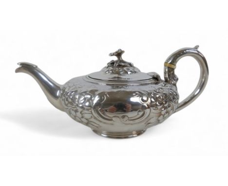 A William IV silver embossed teapot, with floral decoration, and ivory insulators, Benoni Stephens, London 1835, 23 by 14 by 