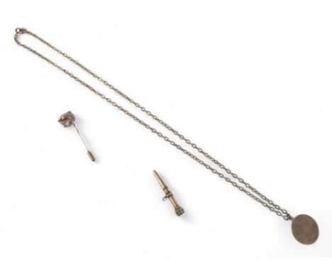A 9ct gold medallion, engraved Peter F Creasey, approximately. 3g, on an unmarked gold metal chain, plus a 9ct gold stick pin