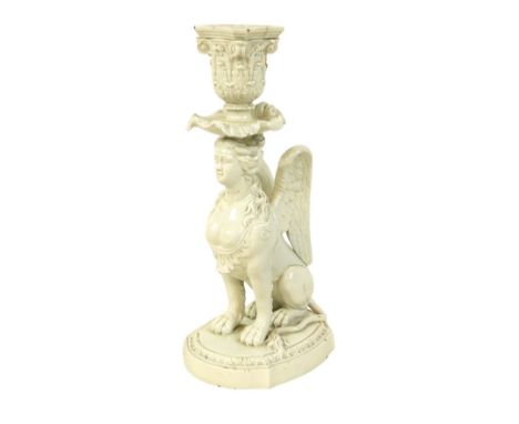 A late 18th century Staffordshire Neale &amp; Co creamware figural candlestick, modelled as a female sphynx with wings and li