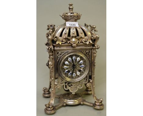 Late 19th Century French silvered brass mantel clock of unusual design, surmounted by a coronet and stylised figures of birds