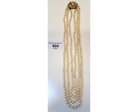 Triple row graduated cultured pearl necklace with a 14ct gold clasp (clasp minus three pearls) 