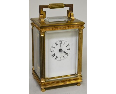 Miniature gilt brass cased carriage clock, the enamel dial with Roman numerals, the case with reeded corner pilasters and sin